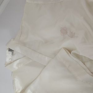 Amanda Gray, Cream color robe with embroidered flower.